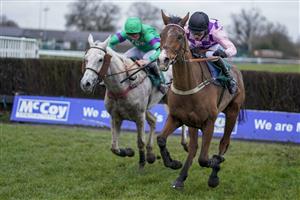 WARWICK, ENGLAND - JANUARY 16: Tom Cannon riding Notachance (pink) clear the last to win The McCoy Contractors Civil Engineering Classic Handicap Chase at Warwick Racecourse on January 16, 2021 in Warwick, England. Due to the Coronavirus pandemic, owners along with the paying public will not be allowed to attend the meeting. (Photo by Alan Crowhurst/Getty Images)