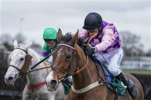 WARWICK, ENGLAND - JANUARY 16: Tom Cannon riding Notachance (pink) clear the last to win The McCoy Contractors Civil Engineering Classic Handicap Chase at Warwick Racecourse on January 16, 2021 in Warwick, England. Due to the Coronavirus pandemic, owners along with the paying public will not be allowed to attend the meeting. (Photo by Alan Crowhurst/Getty Images)