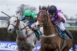 WARWICK, ENGLAND - JANUARY 16: Tom Cannon riding Notachance (pink) clear the last to win The McCoy Contractors Civil Engineering Classic Handicap Chase at Warwick Racecourse on January 16, 2021 in Warwick, England. Due to the Coronavirus pandemic, owners along with the paying public will not be allowed to attend the meeting. (Photo by Alan Crowhurst/Getty Images)