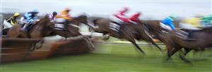 WARWICK, ENGLAND - JANUARY 16: A general view of action over a hurdle at Warwick Racecourse on January 16, 2021 in Warwick, England. Due to the Coronavirus pandemic, owners along with the paying public will not be allowed to attend the meeting. (Photo by Alan Crowhurst/Getty Images)