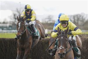 WARWICK, ENGLAND - JANUARY 16: Jonjo O'Neill Jr. riding Sky Pirate (R, yellow) clear the last to win The Edward Courage Cup Handicap Chase at Warwick Racecourse on January 16, 2021 in Warwick, England. Due to the Coronavirus pandemic, owners along with the paying public will not be allowed to attend the meeting. (Photo by Alan Crowhurst/Getty Images)