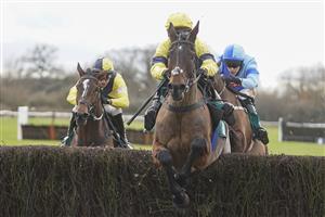 WARWICK, ENGLAND - JANUARY 16: Jonjo O'Neill Jr. riding Sky Pirate (R, yellow) clear the last to win The Edward Courage Cup Handicap Chase at Warwick Racecourse on January 16, 2021 in Warwick, England. Due to the Coronavirus pandemic, owners along with the paying public will not be allowed to attend the meeting. (Photo by Alan Crowhurst/Getty Images)