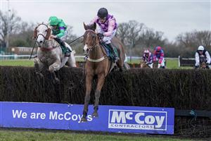 WARWICK, ENGLAND - JANUARY 16: Tom Cannon riding Notachance (pink) clear the last to win The McCoy Contractors Civil Engineering Classic Handicap Chase at Warwick Racecourse on January 16, 2021 in Warwick, England. Due to the Coronavirus pandemic, owners along with the paying public will not be allowed to attend the meeting. (Photo by Alan Crowhurst/Getty Images)