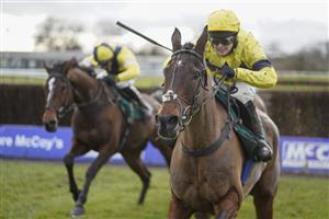 WARWICK, ENGLAND - JANUARY 16: Jonjo O'Neill Jr. riding Sky Pirate (R, yellow) clear the last to win The Edward Courage Cup Handicap Chase at Warwick Racecourse on January 16, 2021 in Warwick, England. Due to the Coronavirus pandemic, owners along with the paying public will not be allowed to attend the meeting. (Photo by Alan Crowhurst/Getty Images)