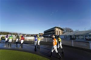 WARWICK, ENGLAND - JANUARY 16: A general view as jockeys make their way to the parade ring at Warwick Racecourse on January 16, 2021 in Warwick, England. Due to the Coronavirus pandemic, owners along with the paying public will not be allowed to attend the meeting. (Photo by Alan Crowhurst/Getty Images)