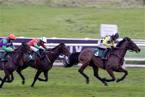 WARWICK, ENGLAND - JANUARY 16: Harry Cobden riding Gold Bullion (R) win The Here Comes McCoy 'Newcomers' Standard Open NH Flat Race at Warwick Racecourse on January 16, 2021 in Warwick, England. Due to the Coronavirus pandemic, owners along with the paying public will not be allowed to attend the meeting. (Photo by Alan Crowhurst/Getty Images)