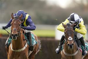 WARWICK, ENGLAND - JANUARY 16: Harry Cobden riding Next Destination (black/white cap) clear the last to win The McCoy Contractors Civils And Infrastructure Hampton Novices' Chase from Jonjo O'Neill Jr. and Fiddlerontheroof (L) at Warwick Racecourse on January 16, 2021 in Warwick, England. Due to the Coronavirus pandemic, owners along with the paying public will not be allowed to attend the meeting. (Photo by Alan Crowhurst/Getty Images)