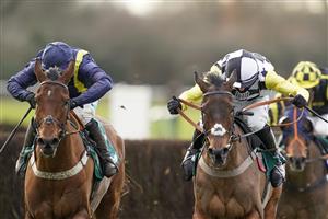 WARWICK, ENGLAND - JANUARY 16: Harry Cobden riding Next Destination (black/white cap) clear the last to win The McCoy Contractors Civils And Infrastructure Hampton Novices' Chase from Jonjo O'Neill Jr. and Fiddlerontheroof (L) at Warwick Racecourse on January 16, 2021 in Warwick, England. Due to the Coronavirus pandemic, owners along with the paying public will not be allowed to attend the meeting. (Photo by Alan Crowhurst/Getty Images)