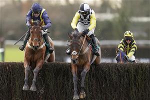 WARWICK, ENGLAND - JANUARY 16: Harry Cobden riding Next Destination (black/white cap) clear the last to win The McCoy Contractors Civils And Infrastructure Hampton Novices' Chase from Jonjo O'Neill Jr. and Fiddlerontheroof (L) at Warwick Racecourse on January 16, 2021 in Warwick, England. Due to the Coronavirus pandemic, owners along with the paying public will not be allowed to attend the meeting. (Photo by Alan Crowhurst/Getty Images)