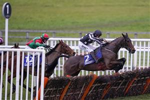 WARWICK, ENGLAND - JANUARY 16: Paddy Brennan riding Imperial Alcazar clear the last to win The Pertemps Network Handicap Hurdle at Warwick Racecourse on January 16, 2021 in Warwick, England. Due to the Coronavirus pandemic, owners along with the paying public will not be allowed to attend the meeting. (Photo by Alan Crowhurst/Getty Images)