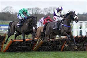 WARWICK, ENGLAND - JANUARY 16: Richard Johnson riding Adrimel (R) clear the last to win The Ballymore Leamington Novices' Hurdle at Warwick Racecourse on January 16, 2021 in Warwick, England. Due to the Coronavirus pandemic, owners along with the paying public will not be allowed to attend the meeting. (Photo by Alan Crowhurst/Getty Images)