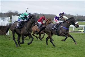 WARWICK, ENGLAND - JANUARY 16: Richard Johnson riding Adrimel (R) clear the last to win The Ballymore Leamington Novices' Hurdle at Warwick Racecourse on January 16, 2021 in Warwick, England. Due to the Coronavirus pandemic, owners along with the paying public will not be allowed to attend the meeting. (Photo by Alan Crowhurst/Getty Images)