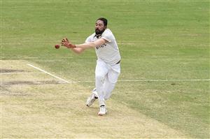 BRISBANE, AUSTRALIA - JANUARY 18: Mohammed Siraj of India fields off his own bowling during day four of the 4th Test Match in the series between Australia and India at The Gabba on January 18, 2021 in Brisbane, Australia. (Photo by Matt Roberts/Getty Images)