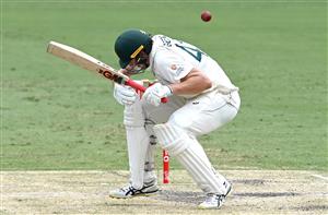 BRISBANE, AUSTRALIA - JANUARY 18: Cameron Green of Australia ducks a bouncer during day four of the 4th Test Match in the series between Australia and India at The Gabba on January 18, 2021 in Brisbane, Australia. (Photo by Bradley Kanaris/Getty Images)