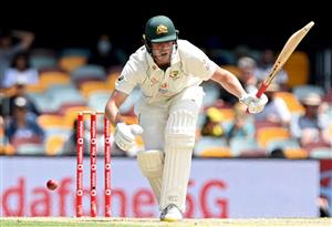 BRISBANE, AUSTRALIA - JANUARY 18: Cameron Green of Australia reacts after being struck by the ball during day four of the 4th Test Match in the series between Australia and India at The Gabba on January 18, 2021 in Brisbane, Australia. (Photo by Bradley Kanaris/Getty Images)