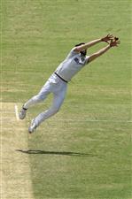 BRISBANE, AUSTRALIA - JANUARY 18: Mohammed Siraj of India fields off his own bowling during day four of the 4th Test Match in the series between Australia and India at The Gabba on January 18, 2021 in Brisbane, Australia. (Photo by Matt Roberts/Getty Images)