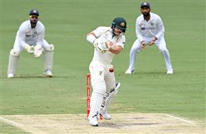 BRISBANE, AUSTRALIA - JANUARY 18: David Warner of Australia plays a shot during day four of the 4th Test Match in the series between Australia and India at The Gabba on January 18, 2021 in Brisbane, Australia. (Photo by Bradley Kanaris/Getty Images)