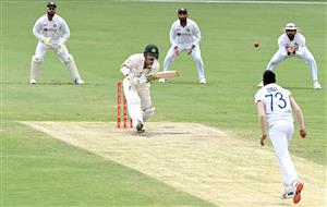 BRISBANE, AUSTRALIA - JANUARY 18: David Warner of Australia plays a shot during day four of the 4th Test Match in the series between Australia and India at The Gabba on January 18, 2021 in Brisbane, Australia. (Photo by Bradley Kanaris/Getty Images)
