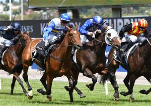 MELBOURNE, AUSTRALIA - JANUARY 16: Jamie Kah riding Liqueuro wins Race 4, the Lexus Summer Event Trophy, during Melbourne Racing at Flemington Racecourse on January 16, 2021 in Melbourne, Australia. (Photo by Vince Caligiuri/Getty Images)