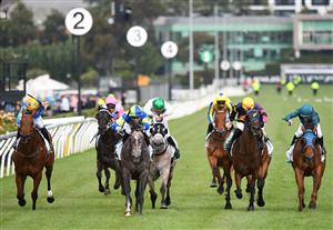 MELBOURNE, AUSTRALIA - JANUARY 16: Jye McNeil riding Housay to win Race 9, the Tab Venue Mode Handicap, during Melbourne Racing at Flemington Racecourse on January 16, 2021 in Melbourne, Australia. (Photo by Vince Caligiuri/Getty Images)