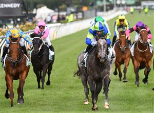 MELBOURNE, AUSTRALIA - JANUARY 16: Jye McNeil riding Housay to win Race 9, the Tab Venue Mode Handicap, during Melbourne Racing at Flemington Racecourse on January 16, 2021 in Melbourne, Australia. (Photo by Vince Caligiuri/Getty Images)