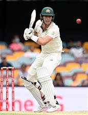 BRISBANE, AUSTRALIA - JANUARY 18: Pat Cummins of Australia bats during day four of the 4th Test Match in the series between Australia and India at The Gabba on January 18, 2021 in Brisbane, Australia. (Photo by Bradley Kanaris/Getty Images)
