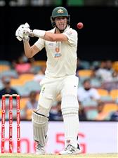 BRISBANE, AUSTRALIA - JANUARY 18: Pat Cummins of Australia bats during day four of the 4th Test Match in the series between Australia and India at The Gabba on January 18, 2021 in Brisbane, Australia. (Photo by Bradley Kanaris/Getty Images)
