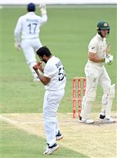 BRISBANE, AUSTRALIA - JANUARY 18: Shardul Thakur of India celebrates taking the wicket of Tim Paine of Australia during day four of the 4th Test Match in the series between Australia and India at The Gabba on January 18, 2021 in Brisbane, Australia. (Photo by Bradley Kanaris/Getty Images)