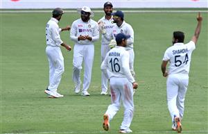 BRISBANE, AUSTRALIA - JANUARY 18: Shardul Thakur of India and team mates celebrate taking the wicket of Cameron Green of Australia during day four of the 4th Test Match in the series between Australia and India at The Gabba on January 18, 2021 in Brisbane, Australia. (Photo by Bradley Kanaris/Getty Images)