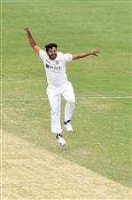 BRISBANE, AUSTRALIA - JANUARY 18: Shardul Thakur of India celebrates the wicket of Tim Paine of Australia during day four of the 4th Test Match in the series between Australia and India at The Gabba on January 18, 2021 in Brisbane, Australia. (Photo by Matt Roberts/Getty Images)