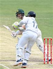 BRISBANE, AUSTRALIA - JANUARY 18: Steve Smith of Australia plays a shot during day four of the 4th Test Match in the series between Australia and India at The Gabba on January 18, 2021 in Brisbane, Australia. (Photo by Bradley Kanaris/Getty Images)