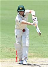 BRISBANE, AUSTRALIA - JANUARY 18: Steve Smith of Australia is struck by the ball during day four of the 4th Test Match in the series between Australia and India at The Gabba on January 18, 2021 in Brisbane, Australia. (Photo by Bradley Kanaris/Getty Images)