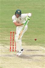 BRISBANE, AUSTRALIA - JANUARY 18: Tim Paine of Australia bats during day four of the 4th Test Match in the series between Australia and India at The Gabba on January 18, 2021 in Brisbane, Australia. (Photo by Matt Roberts/Getty Images)