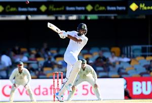 BRISBANE, AUSTRALIA - JANUARY 19: Washington Sundar of India hits the ball over the boundary for a six during day five of the 4th Test Match in the series between Australia and India at The Gabba on January 19, 2021 in Brisbane, Australia. (Photo by Bradley Kanaris/Getty Images)