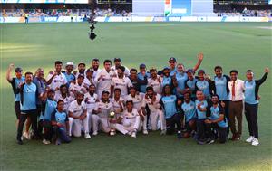 Indian players and officials celebrate with the winning trophy at the end of the fourth cricket Test match between Australia and India at The Gabba in Brisbane on January 19, 2021. (Photo by Patrick HAMILTON / AFP) / --IMAGE RESTRICTED TO EDITORIAL USE - STRICTLY NO COMMERCIAL USE-- (Photo by PATRICK HAMILTON/AFP via Getty Images)