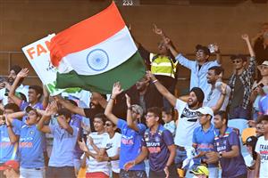 BRISBANE, AUSTRALIA - JANUARY 19: The Indian fans celebrate during day five of the 4th Test Match in the series between Australia and India at The Gabba on January 19, 2021 in Brisbane, Australia. (Photo by Bradley Kanaris/Getty Images)