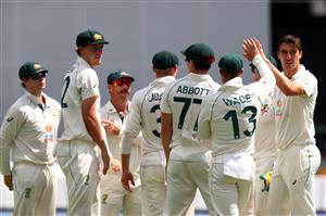 BRISBANE, AUSTRALIA - JANUARY 19: Pat Cummins of Australia celebrates taking the wicket of Ajinkya Rahane of India during day five of the 4th Test Match in the series between Australia and India at The Gabba on January 19, 2021 in Brisbane, Australia. (Getty)