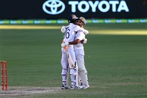 BRISBANE, AUSTRALIA - JANUARY 19: Rishabh Pant and Navdeep Saini of India celebrate victory during day five of the 4th Test Match in the series between Australia and India at The Gabba on January 19, 2021 in Brisbane, Australia. (Photo by Matt Roberts/Getty Images)