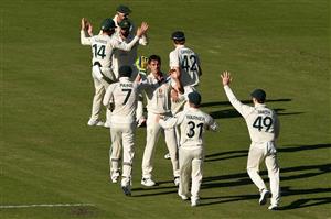 BRISBANE, AUSTRALIA - JANUARY 19: Pat Cummins of Australia celebrates taking the wicket of Mayank Agarwal of India during day five of the 4th Test Match in the series between Australia and India at The Gabba on January 19, 2021 in Brisbane, Australia. (Photo by Matt Roberts/Getty Images)
