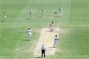 BRISBANE, AUSTRALIA - JANUARY 19: Pat Cummins of Australia celebrates taking the wicket of Ajinkya Rahane of India during day five of the 4th Test Match in the series between Australia and India at The Gabba on January 19, 2021 in Brisbane, Australia. (Photo by Bradley Kanaris/Getty Images)