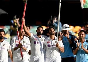 BRISBANE, AUSTRALIA - JANUARY 19: Rishabh Pant of India celebrates victory with his team mates after day five of the 4th Test Match in the series between Australia and India at The Gabba on January 19, 2021 in Brisbane, Australia. (Photo by Bradley Kanaris/Getty Images)