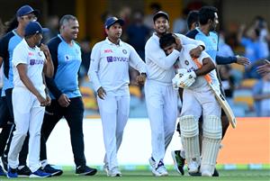 BRISBANE, AUSTRALIA - JANUARY 19: Rishabh Pant of India celebrates victory with his team mates after day five of the 4th Test Match in the series between Australia and India at The Gabba on January 19, 2021 in Brisbane, Australia. (Photo by Bradley Kanaris/Getty Images)