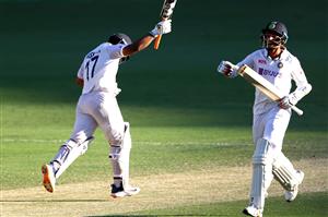 BRISBANE, AUSTRALIA - JANUARY 19: Rishabh Pant and Navdeep Saini of India celebrate victory during day five of the 4th Test Match in the series between Australia and India at The Gabba on January 19, 2021 in Brisbane, Australia. (Photo by Matt Roberts/Getty Images)