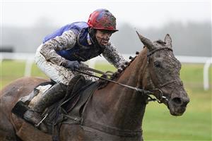 NEWBURY, ENGLAND - JANUARY 20: Jockey Robert Dunne in action at Newbury Racecourse on January 20, 2021 in Newbury, England. Due to the Coronavirus pandemic, owners along with the paying public will not be allowed to attend the meeting. (Photo by Alan Crowhurst/Getty Images)
