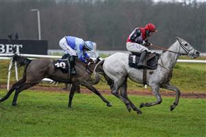 NEWBURY, ENGLAND - JANUARY 20: Harry Bannister riding Fagan clear the last to win The MansionBet's Best Odds Guaranteed Handicap Chase at Newbury Racecourse on January 20, 2021 in Newbury, England. Due to the Coronavirus pandemic, owners along with the paying public will not be allowed to attend the meeting. (Photo by Alan Crowhurst/Getty Images)