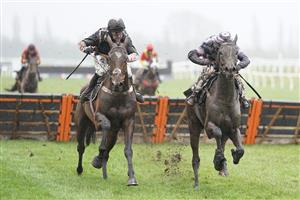 NEWBURY, ENGLAND - JANUARY 20: Nico de Boinville riding Gallyhill (L) clear the last to win The MansionBet Is Proud To Sponsor British Racing Novices' Hurdle from Jamie Moore and Robin's Dream (R) at Newbury Racecourse on January 20, 2021 in Newbury, England. Due to the Coronavirus pandemic, owners along with the paying public will not be allowed to attend the meeting. (Photo by Alan Crowhurst/Getty Images)