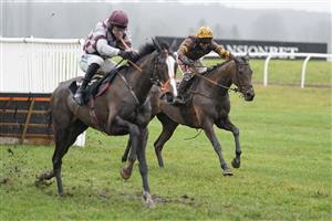 NEWBURY, ENGLAND - JANUARY 20: Richard Johnson riding Little River Bay (R) clear the last to win The British EBF Mares' 'National Hunt' Novices' Hurdle at Newbury Racecourse on January 20, 2021 in Newbury, England. Due to the Coronavirus pandemic, owners along with the paying public will not be allowed to attend the meeting. (Photo by Alan Crowhurst/Getty Images)