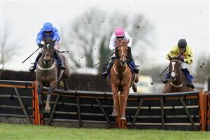 WINCANTON, ENGLAND - JANUARY 21: Adam Wedge riding Mack The Man (blue) clear the last to wi The Visit racingtv.com Handicap Hurdle at Wincanton Racecourse on January 21, 2021 in Wincanton, England. Due to the Coronavirus pandemic, owners along with the paying public will not be allowed to attend the meeting. (Photo by Alan Crowhurst/Getty Images)