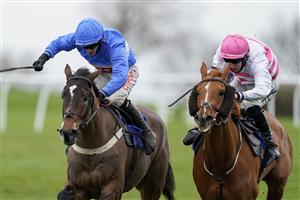 WINCANTON, ENGLAND - JANUARY 21: Adam Wedge riding Mack The Man (blue) clear the last to wi The Visit racingtv.com Handicap Hurdle at Wincanton Racecourse on January 21, 2021 in Wincanton, England. Due to the Coronavirus pandemic, owners along with the paying public will not be allowed to attend the meeting. (Photo by Alan Crowhurst/Getty Images)