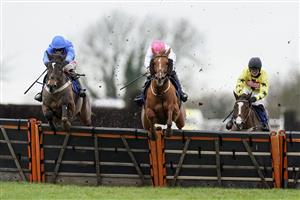 WINCANTON, ENGLAND - JANUARY 21: Adam Wedge riding Mack The Man (blue) clear the last to wi The Visit racingtv.com Handicap Hurdle at Wincanton Racecourse on January 21, 2021 in Wincanton, England. Due to the Coronavirus pandemic, owners along with the paying public will not be allowed to attend the meeting. (Photo by Alan Crowhurst/Getty Images)